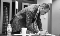 Always organized and ready to tell the stories of college athletics, Gus Johnson is prepping pre-game for a broadcast.